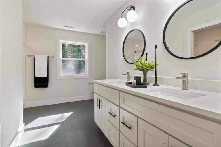 modern white bathroom with black accents