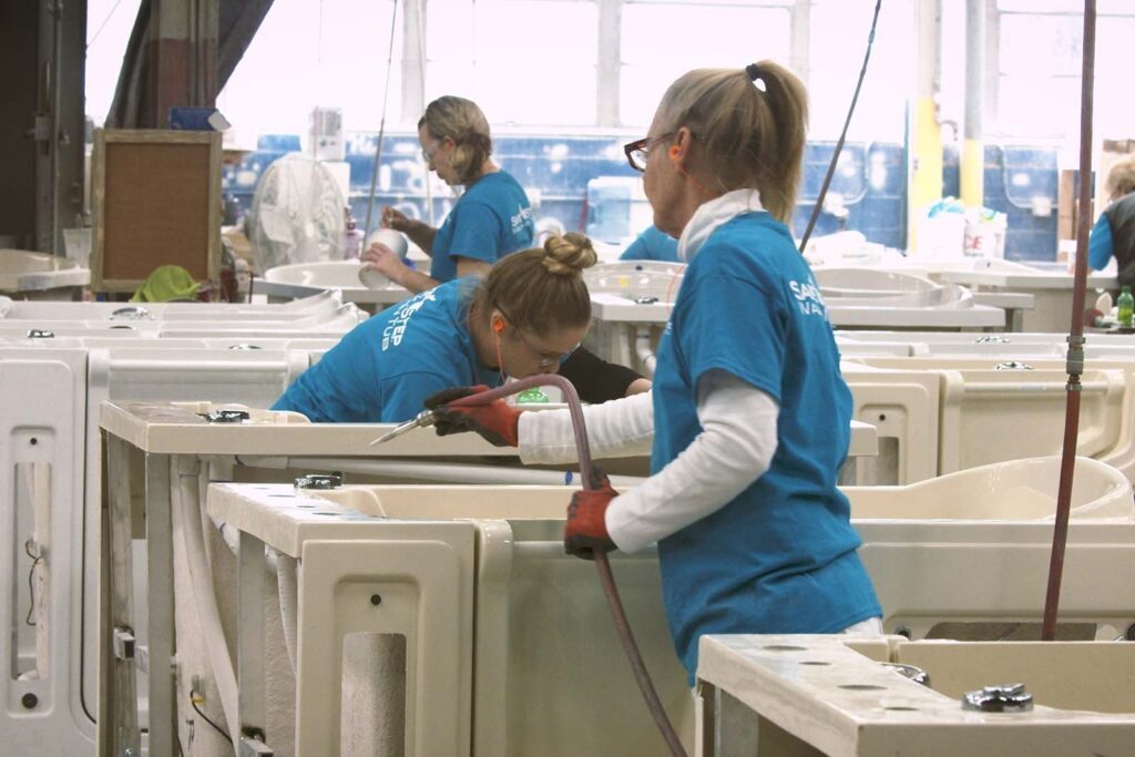 workers putting final touches on the tub during the building process