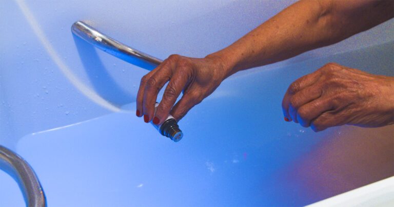 pouring essential oils in the walk-in tub