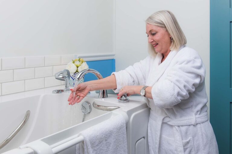 woman quickly filling her tub with a rapid fill faucet