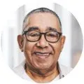 old man with glasses smiling