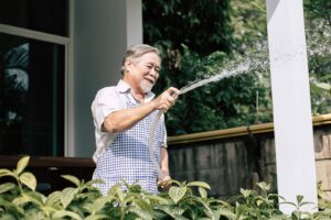 Senior man watering his garden