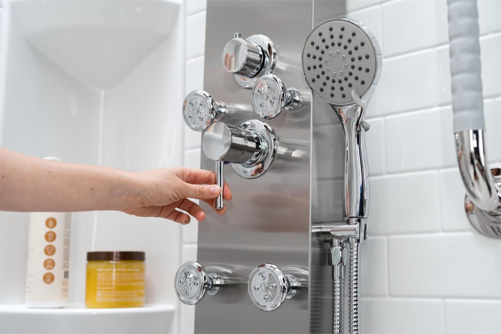 Woman turning on walk-in shower